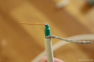 Discone antenna - Preparing coax cable: Putting on some heat shrink tubing to insulate the core from the braided shield